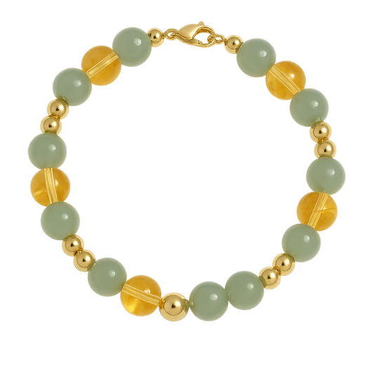 Abundant Glow Bracelet with Green Aventurine and Yellow Citrine gemstone beads and gold accents on a light background