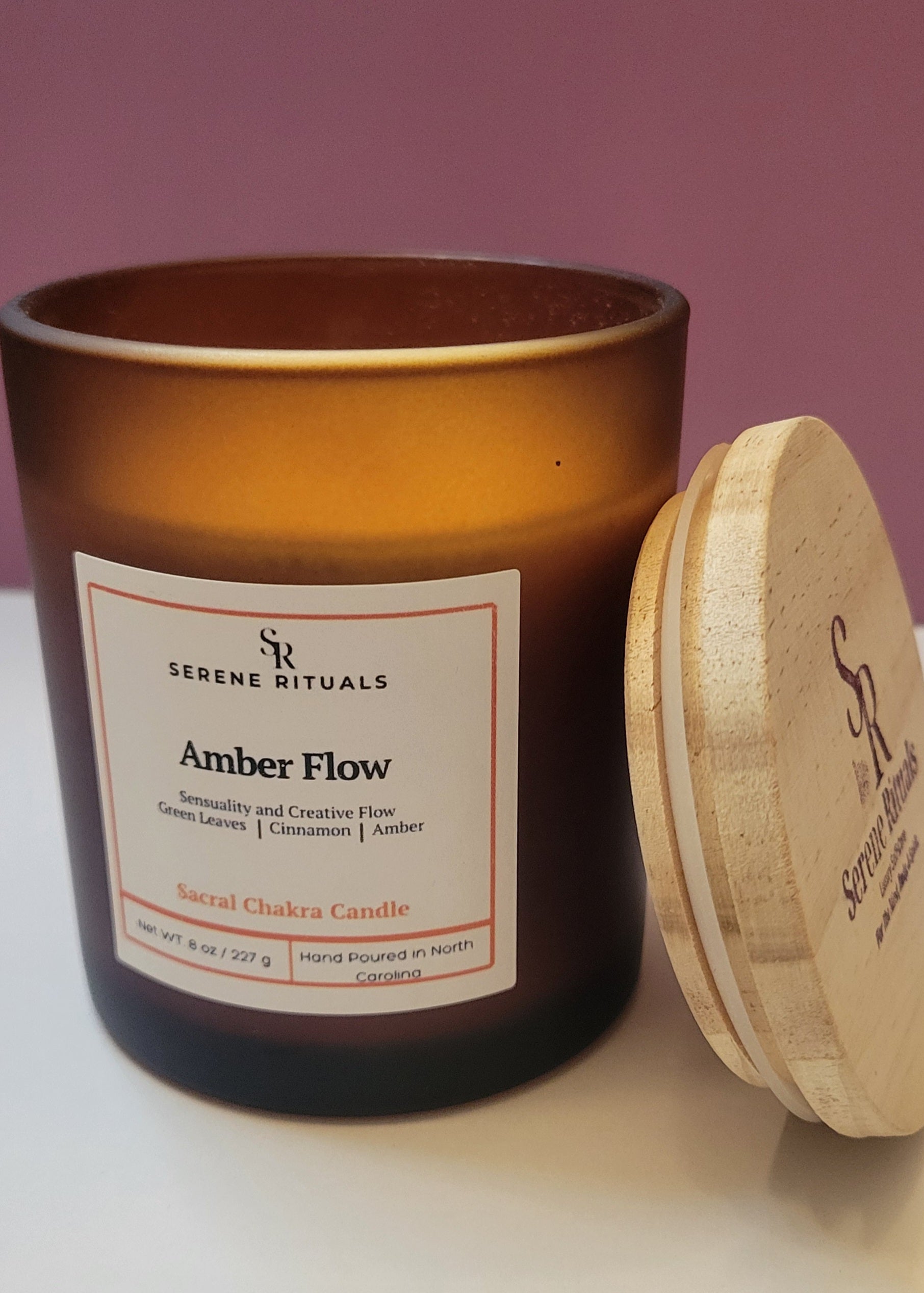 Serene Rituals Amber Flow candle with wooden lid on a light surface