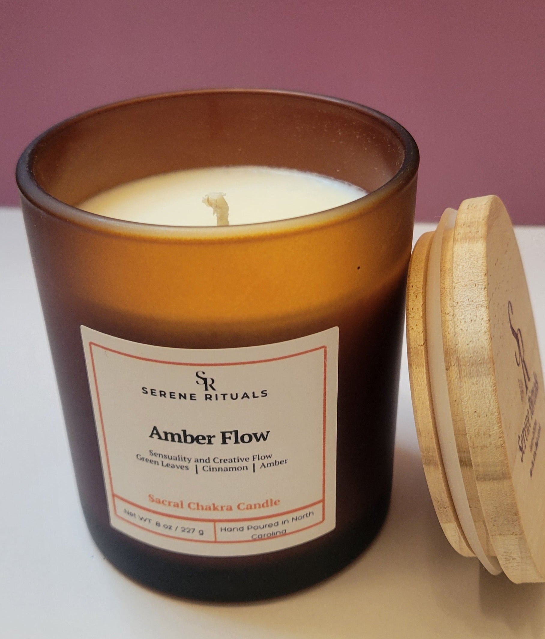 Serene Rituals Amber Flow candle with wooden lid on a white surface