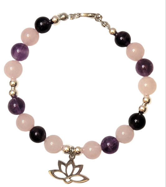 Heart and Soul Bracelet with Amethyst and Rose Quartz beads and lotus flower charm on a white background