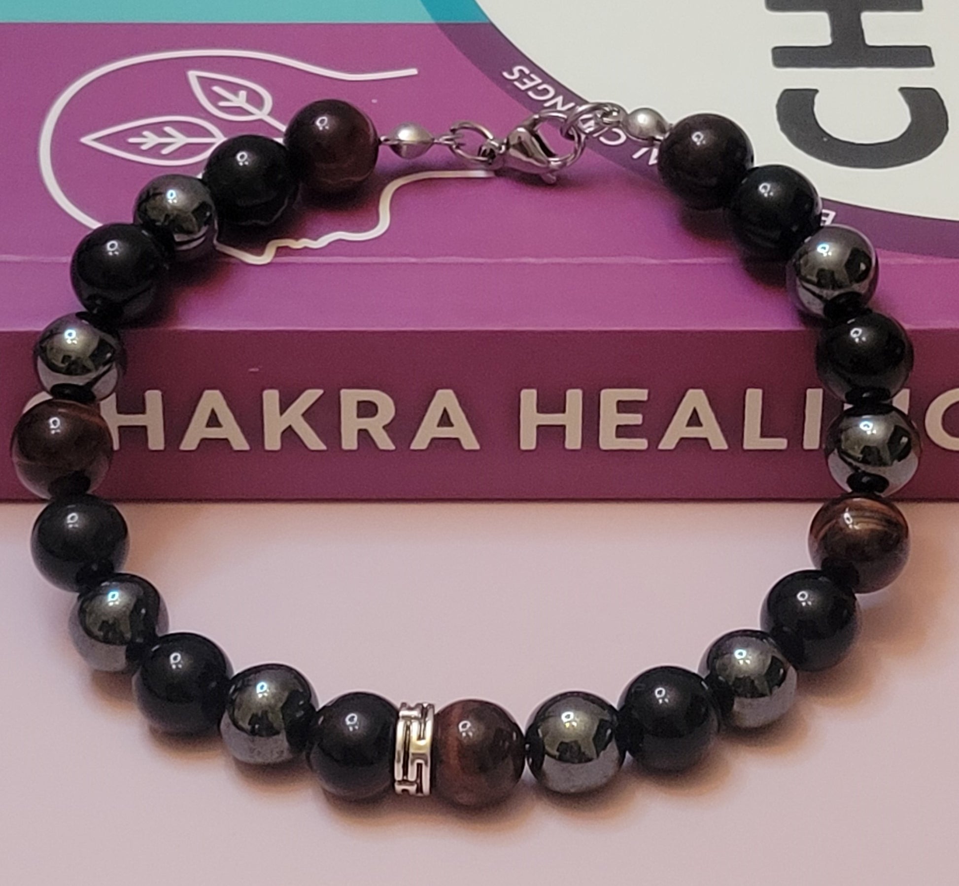 Midnight Armor gemstone  bracelet with black Obsidian, Red Tiger's Eye, and Hematite gemstone beads a purple 'Chakra Healing' box.
