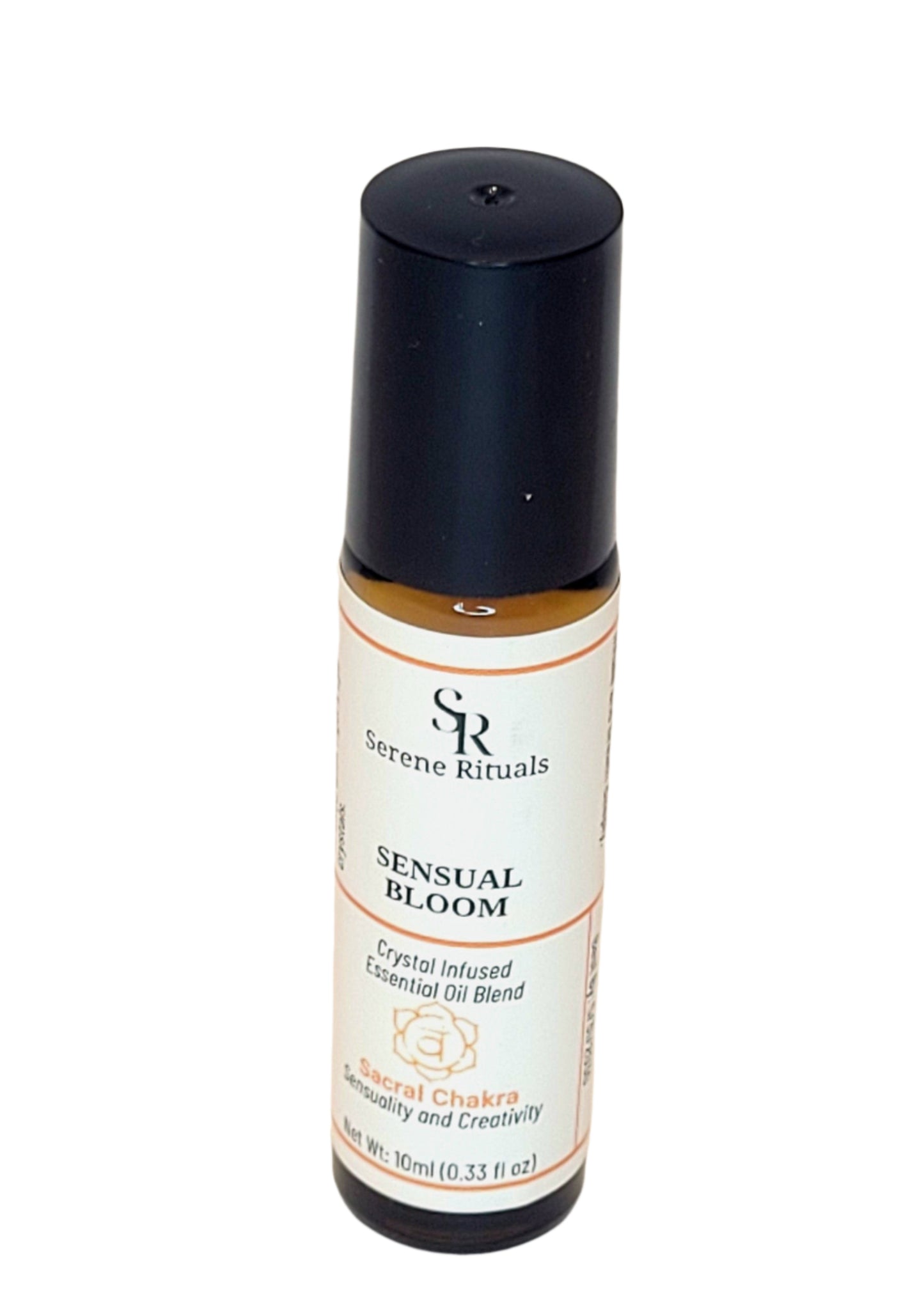 Bottle of 'Sensual Bloom' essential oil blend with a black cap on a beige background