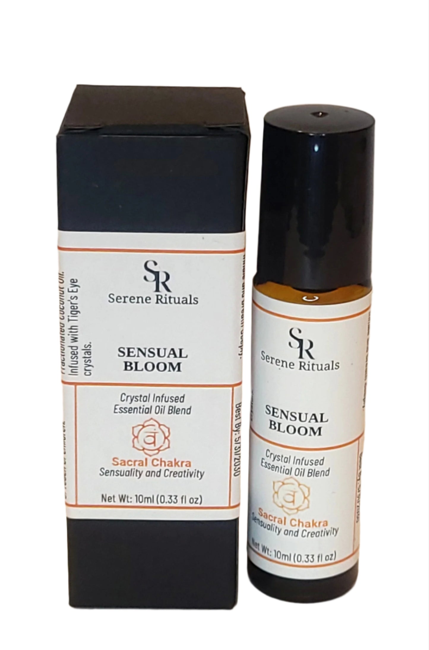 A bottle of Sensual Bloom essential oil blend with their packaging on a beige background